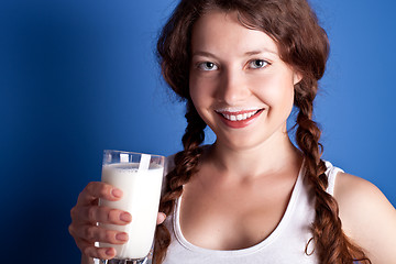 Image showing woman enjoying a glass milk 