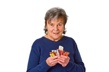 Image showing Female senior with pills