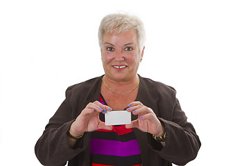 Image showing Female senior with business card 