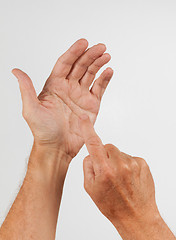 Image showing Male hand holding invisible smartphone