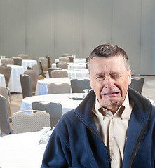 Image showing Man crying in empty conference room