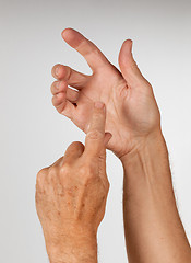 Image showing Male hand holding invisible smartphone