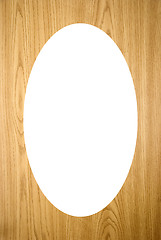 Image showing Isolated white oval on wood imitation background 