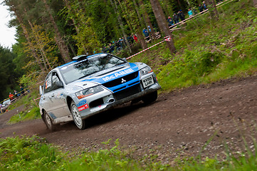 Image showing V. Mcaree driving Mitsubishi Evo