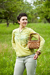 Image showing woman with basket in the garden