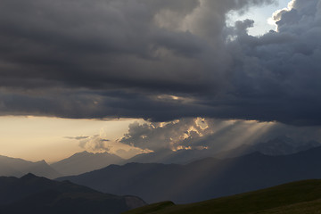 Image showing Silhouettes of mountains in clouds