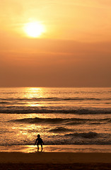 Image showing Child plays on the evening beach