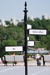 Image showing directional  arrow sign in a city park crossroad 