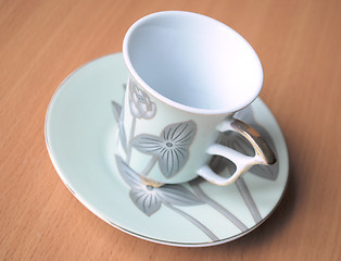 Image showing empty cup and saucer  with pattern  