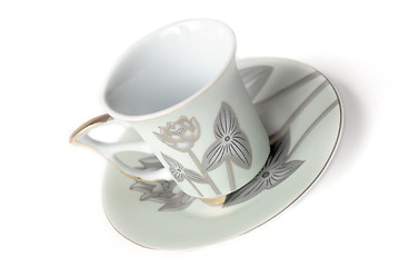 Image showing empty cup and saucer  with pattern  