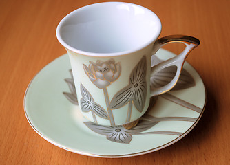 Image showing empty cup and saucer  with pattern  