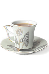 Image showing cup of coffee with milk or cream and saucer 