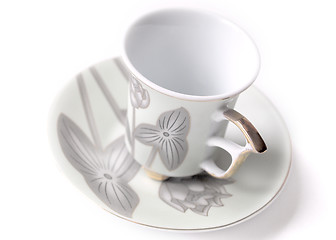 Image showing empty cup and saucer  with pattern  