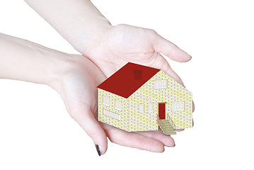 Image showing The house in human hands isolated in white