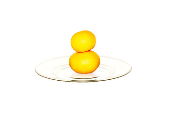 Image showing two tangerines on plate isolated on white             