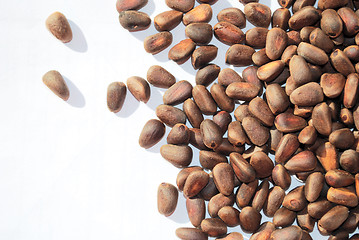 Image showing pine nuts on white, not peeled 