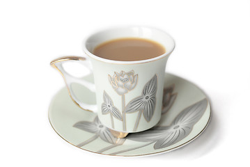 Image showing cup of coffee with milk or cream and saucer 