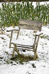 Image showing Chair in the snowy vegetable garden