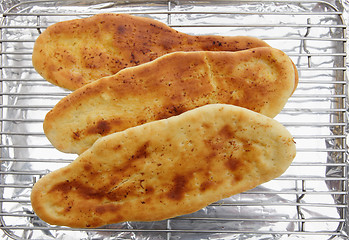 Image showing Baking naan bread