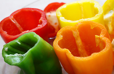 Image showing Bowl of peppers tops cut off