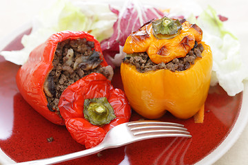 Image showing Stuffed red and yellow peppers