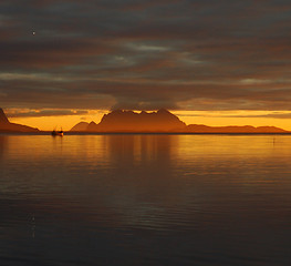 Image showing Boat in sunset on the fjord