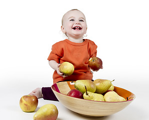 Image showing laughing baby with apples