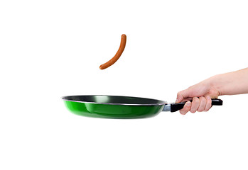 Image showing Pan in hand with sausage