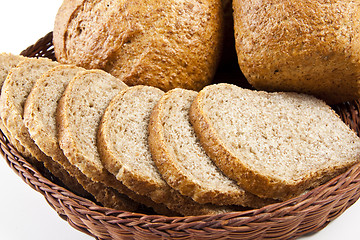 Image showing bread with slices in basket close-up