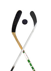 Image showing Hockey stick and puck on white