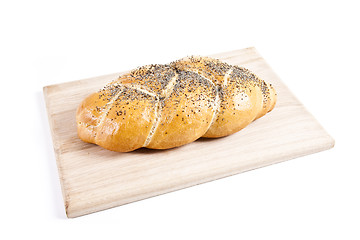 Image showing The fresh buns isolated on wooden plate