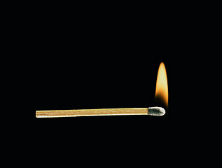 Image showing Burning match on a black background