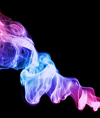 Image showing A swirled spiral of colored smoke on a black background