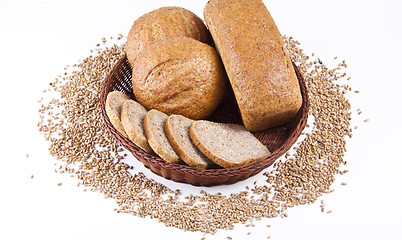Image showing Assortment of baked bread with wheat isolated