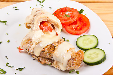 Image showing chicken with sliced ??cucumber and tomatoes