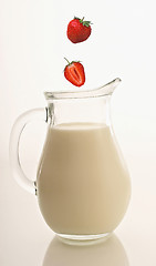 Image showing Jug of milk and strawberry