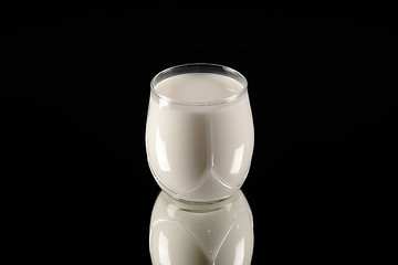 Image showing milk glass on black background