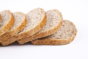 Image showing The cut loaf of bread with reflaction isolated on white