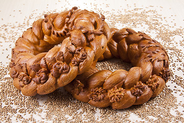 Image showing two breads with grain background