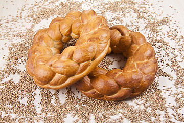 Image showing two breads with grain background