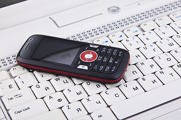 Image showing keyboard and mobile phone background