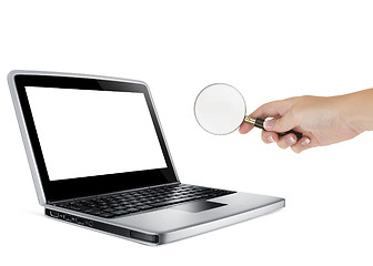 Image showing Laptop with a magnify glass
