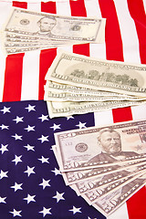 Image showing US flag with dollars background
