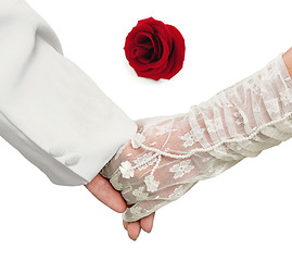 Image showing Close-up Holding Hands with red rose