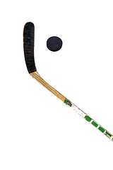 Image showing Hockey stick and puck on white