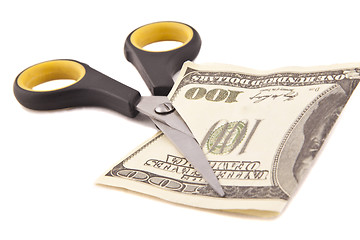 Image showing Scissors cuts one american dollar note isolated