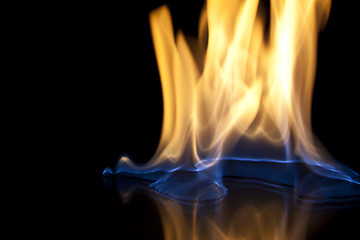 Image showing Fire flames over black background texture