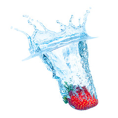 Image showing Fresh Strawberry Dropped into Water with Splash