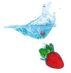 Image showing Fresh Strawberry Dropped into Water with Splash