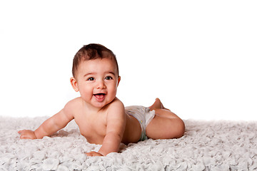 Image showing Happy baby laying on belly